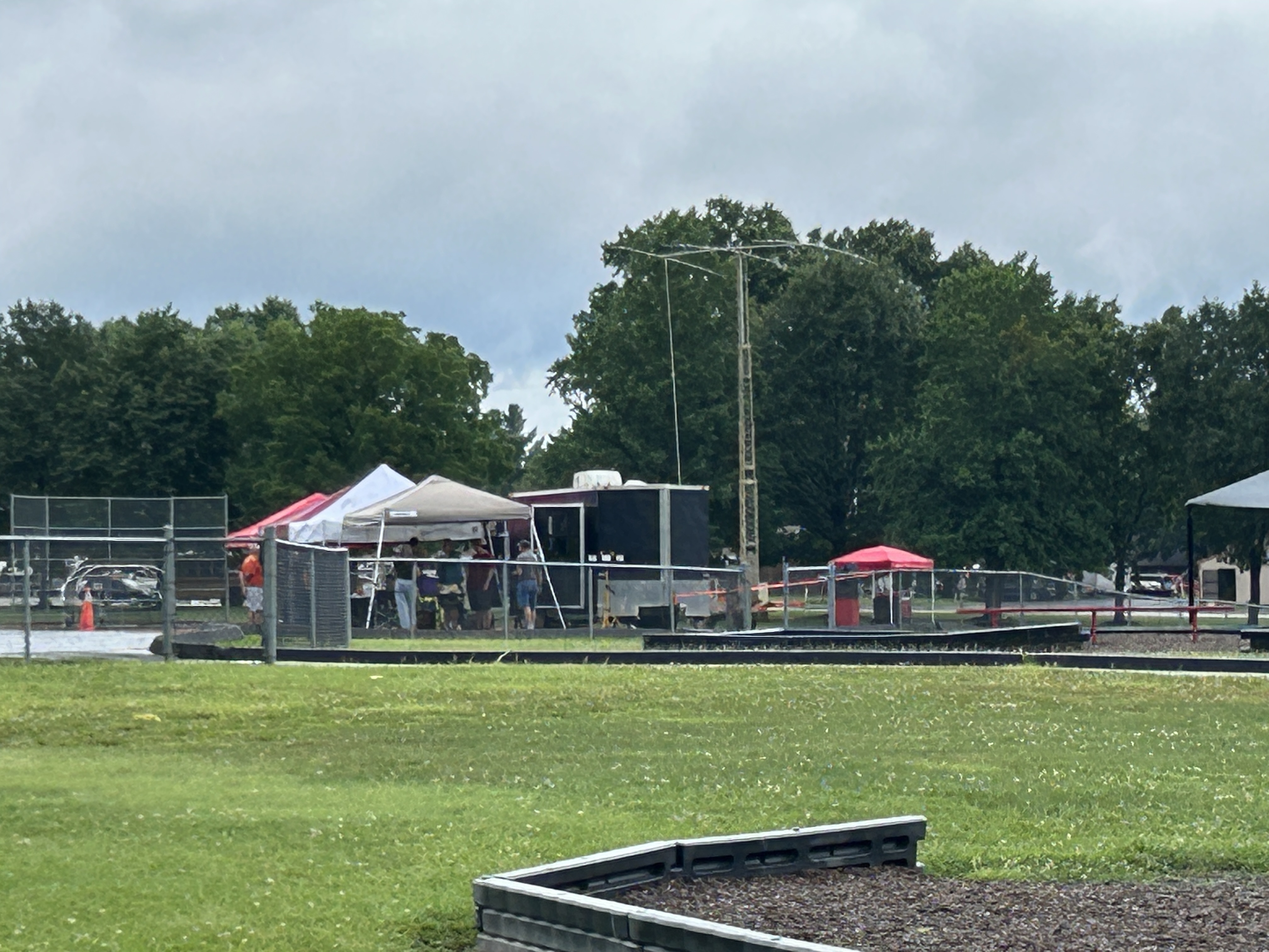The communications trailer with its tower and antennas raised.